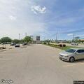 Man lying in grass near Chili's in Akron