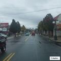 Disabled car blocking train tracks near restaurant