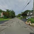 Two masked men sitting by hydrant on Short Road