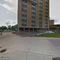 Person experiencing chest pain at university building