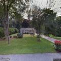 Loose white dog reported near Powell Road