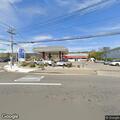 Traffic stop on white Ford Transit near gas station
