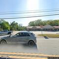 Officers check crash report at Hamburg parking lot