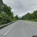Disabled vehicle with flat tire on Route 15