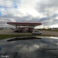 Person with breathing difficulty at gas station