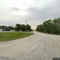 Car leaves roadway and ends up in pond