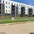 Person sitting outside apartment door reported