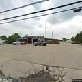 Person experiencing back pain at fire station