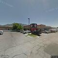 Man unconscious but breathing at Wall Avenue table