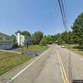 Person with severe back pain at Skytop Drive