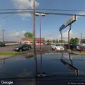 Person tampering with vehicle in parking lot