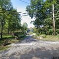 Tree and wires down block Wood Road in Bedford