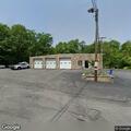 Person experiencing back pain at fire station
