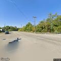 Disabled vehicle leaking gasoline on roadway