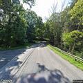 Fallen trees block and line Valley Forge Road