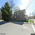 Woman throwing objects on McEwen Street