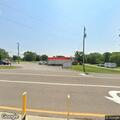 Intoxicated driver smoking at gas station pumps