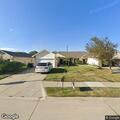 Open door and unoccupied vehicle at residence