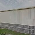 Man lying on ground in front of store at Carter Lake IA