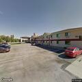 female experiencing alcohol withdrawal at motel lobby
