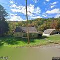 Tree on wires blocking road in Jay Township