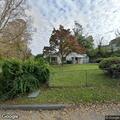 Resident reports person on property at Oak Street