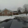 Woman asleep in car at library parking lot