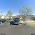 Red SUV parked for long periods, occupants smoking