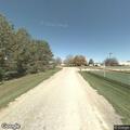 Report of car driving wrong way and hitting curb