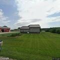 Gas leaking from large LP tank at rural property