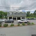 Vehicle collision in auto shop parking lot