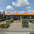 Person experiencing back pain at garden center