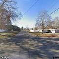 Tree limb down damaging service line to house