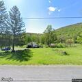 Person on front porch in Trout Run