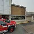 Officer checks vehicle at store loading ramp