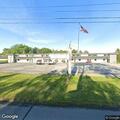 Man found slumped over in truck at hotel parking lot
