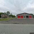 Vehicle rollover crash in front of firehouse