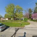 Bird tangled in string in tree at residence