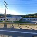 Garbage truck fire at industrial facility