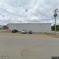 Police check report of woman in machine behind store