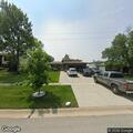 Car leaves roadway and hits parked vehicle