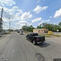 Crash between box truck and sedan on Miles Avenue