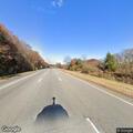 Female lying behind vehicle on I-91 southbound shoulder