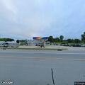 Officer checks suspicious vehicle at gas station