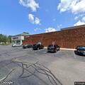 Two vehicles crash in parking lot, one leaves scene