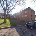 Person found sitting near dumpsters crying at apartment