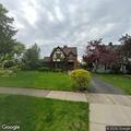 Person walking on driveways and looking at porches