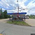 Woman falls and hits head bleeding at Gas USA lot