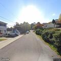 Low-hanging cable causing road hazard on 8th St