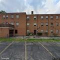 Woman breaks glass door and enters apartment building